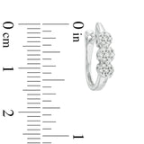 Pre-Owned Zales 1/4ct tw Diamond Flower Huggie Earrings in 10k White Gold